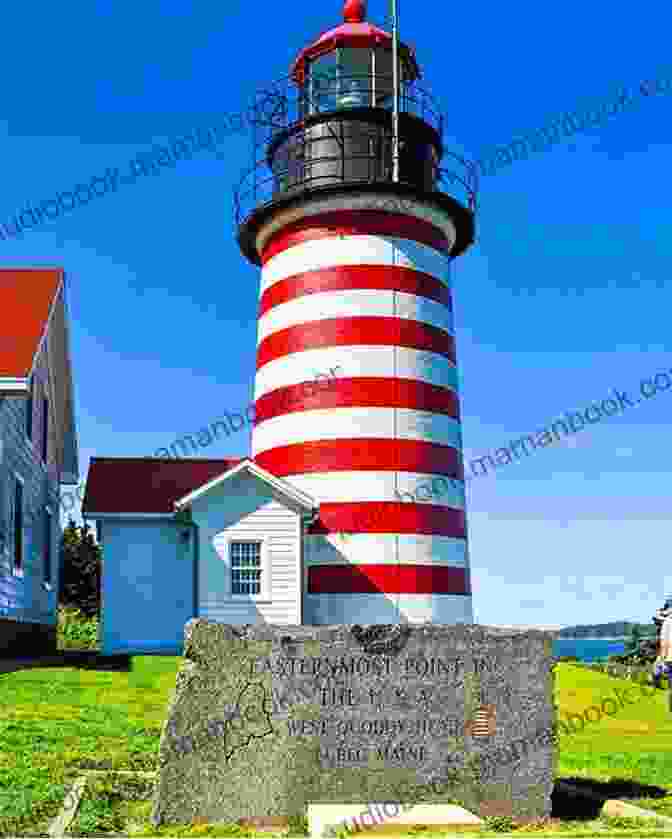 A White Lighthouse Standing On A Rocky Coastline Wisteria Island Rachel Hanna