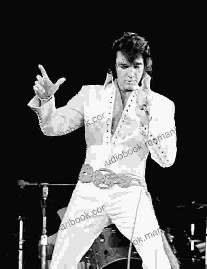 Elvis Presley Performing On Stage In A White Jumpsuit Who Was Elvis Presley? (Who Was?)